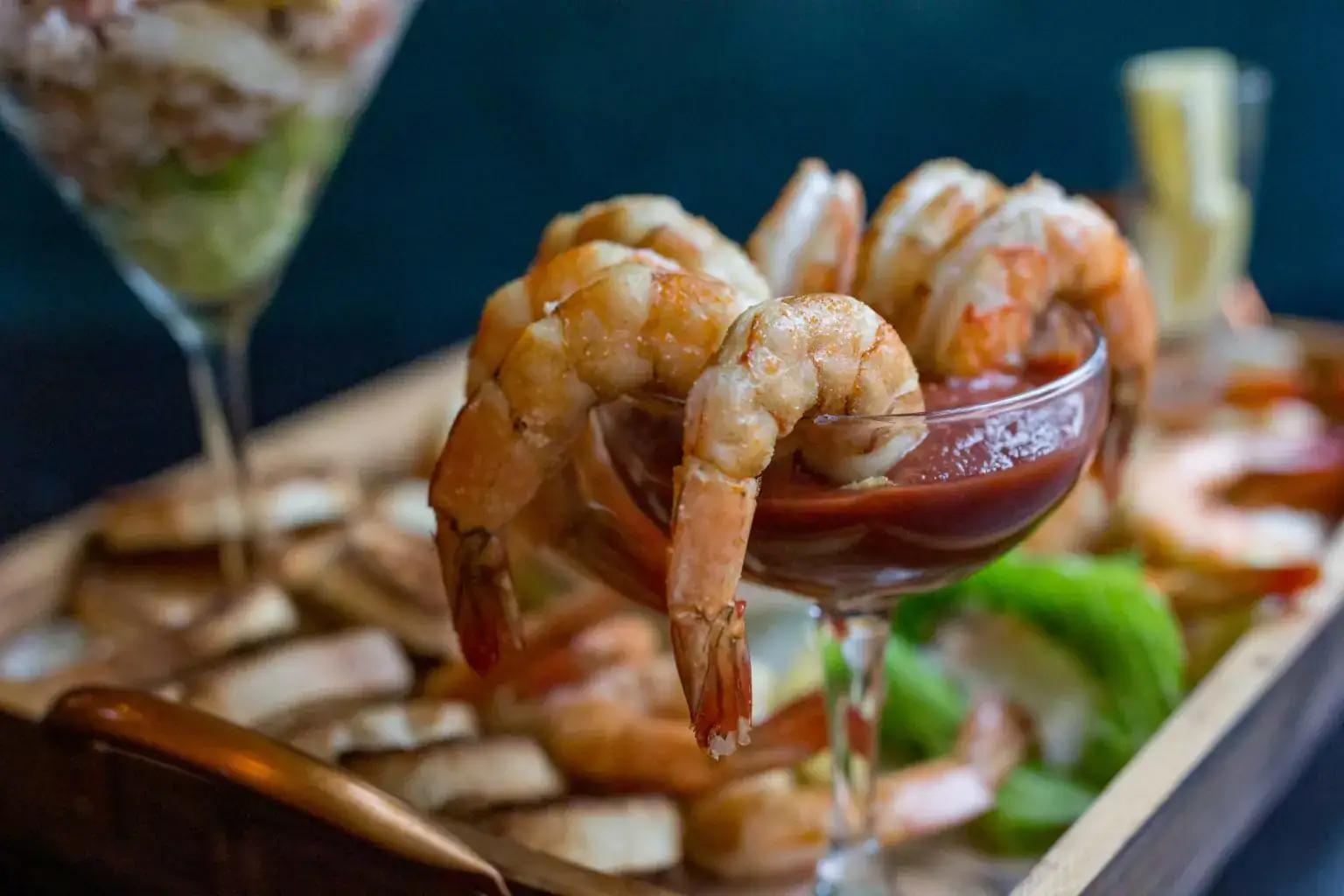 Chilled shrimp served with cocktail sauce.