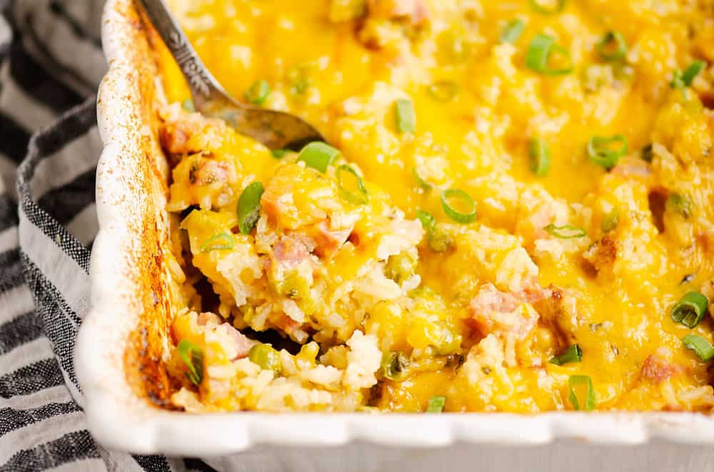 Rice casserole with ham and melted cheese.