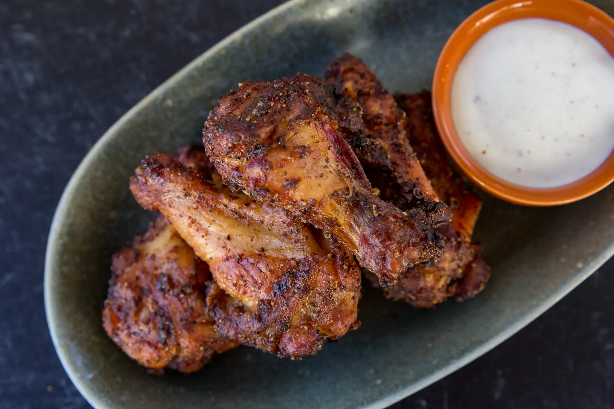 Crispy chicken wings with smoky flavor.