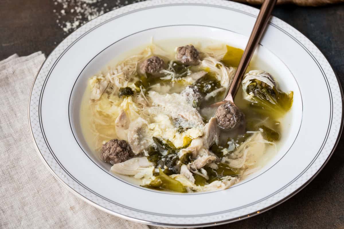 Soup with meatballs, greens, and pasta.