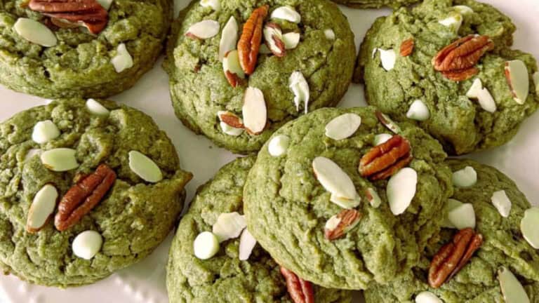 Soft and chewy matcha cookies with sweet white chocolate chips on a plate.