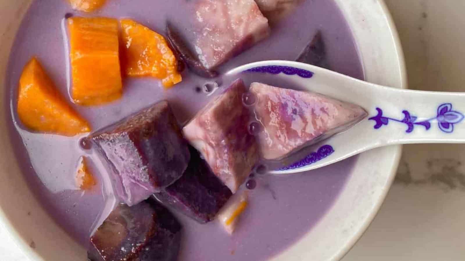 Creamy coconut dessert with sweetpotatoess, purple yam, and chewy tapioca pearls in a bowl.