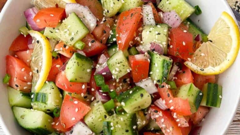 Light and refreshing Asian salad with cucumbers, tomatoes, and tangy dressing.
