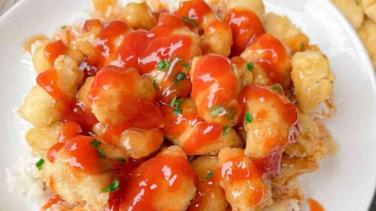 Crispy, sweet, and sour chicken cooked perfectly in the air fryer.