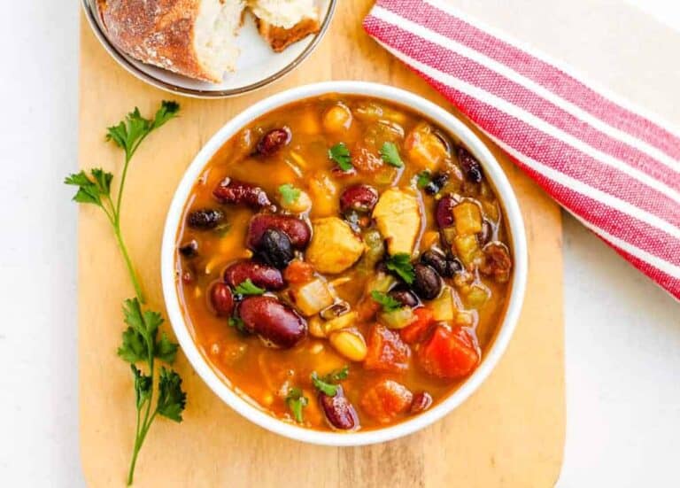 Overhead image of a bowl of chicken bean soup.