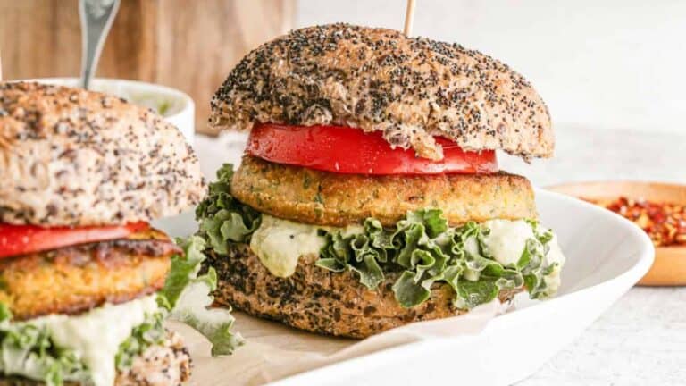 Image shows two Vegan Chickpea Burger Recipe (Gluten-Free) in a white bowl.