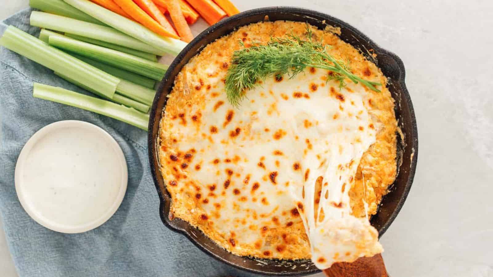 Buffalo jackfruit dip in a black bowl.