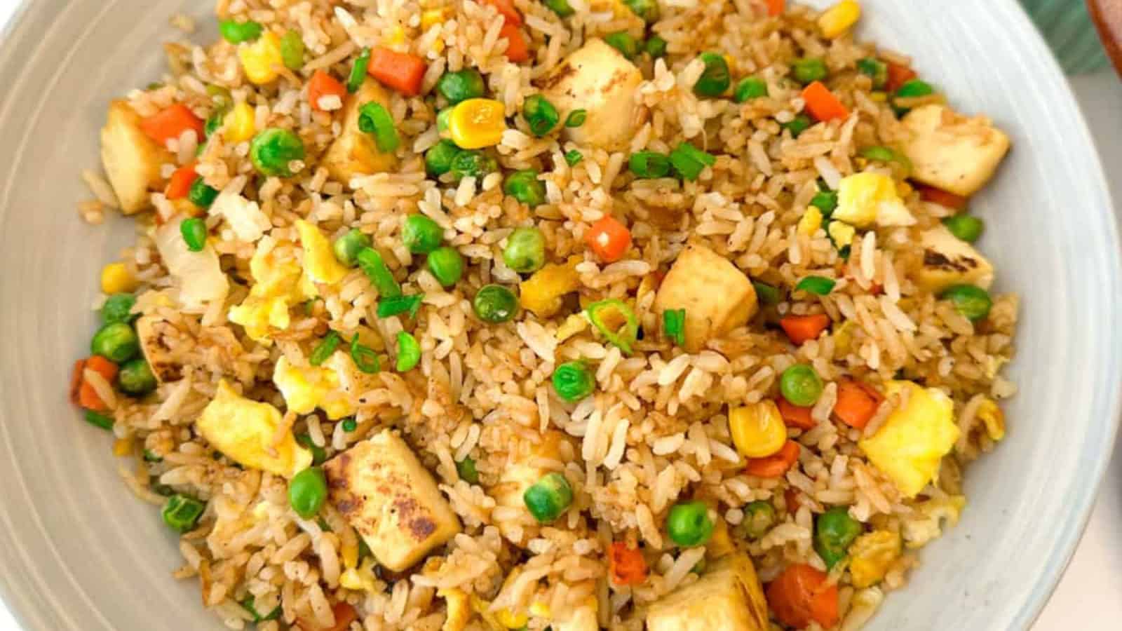 A flavorful tofu fried rice on a plate.