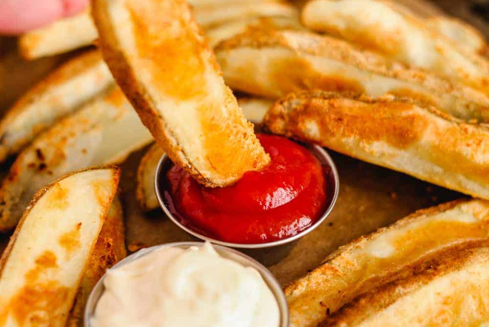 A plate of crispy Oven Baked Potato Wedges.