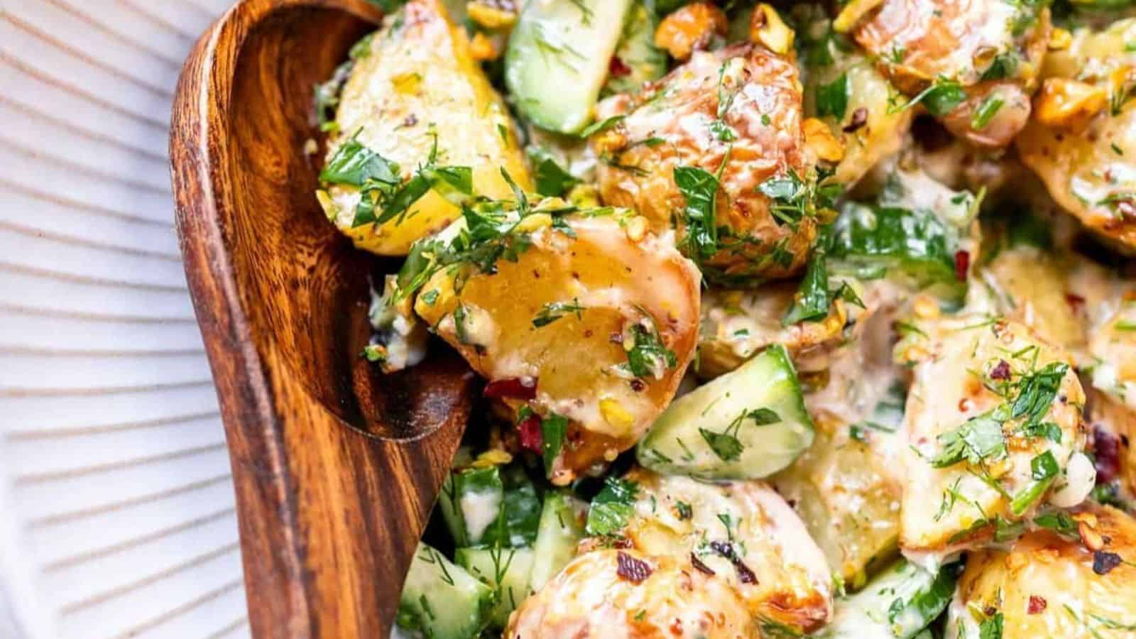 A vibrant roasted potato salad featuring Yukon Gold potatoes, crisp cucumber, green onions, fresh dill and parsley, crunchy pistachios, and a creamy homemade dressing.