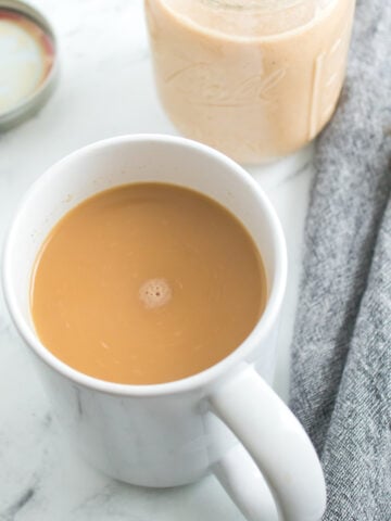 Homemade pumpkin spice coffee creamer in a white cup.