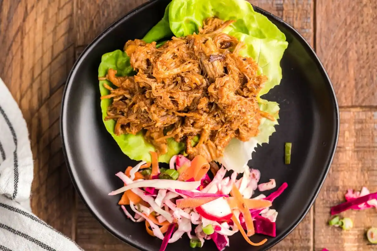Pulled pork served with a side of dairy-free coleslaw.