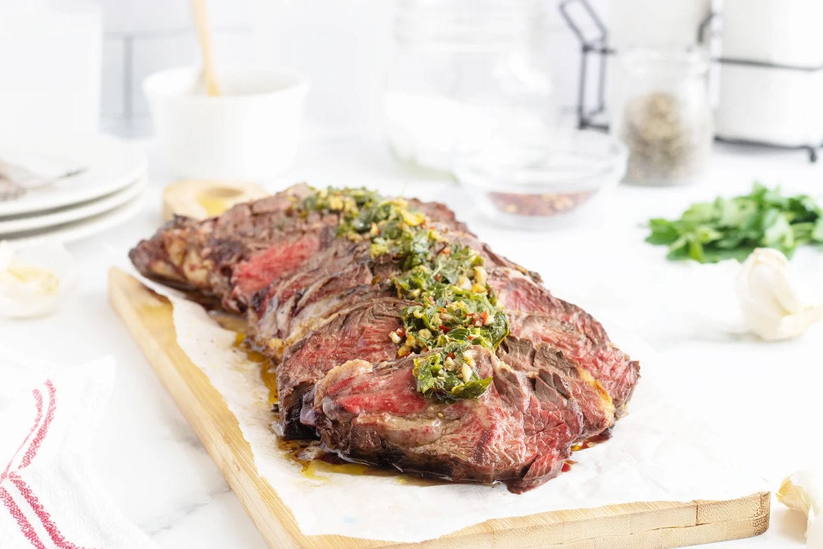 Grilled hanger steak with charred edges.