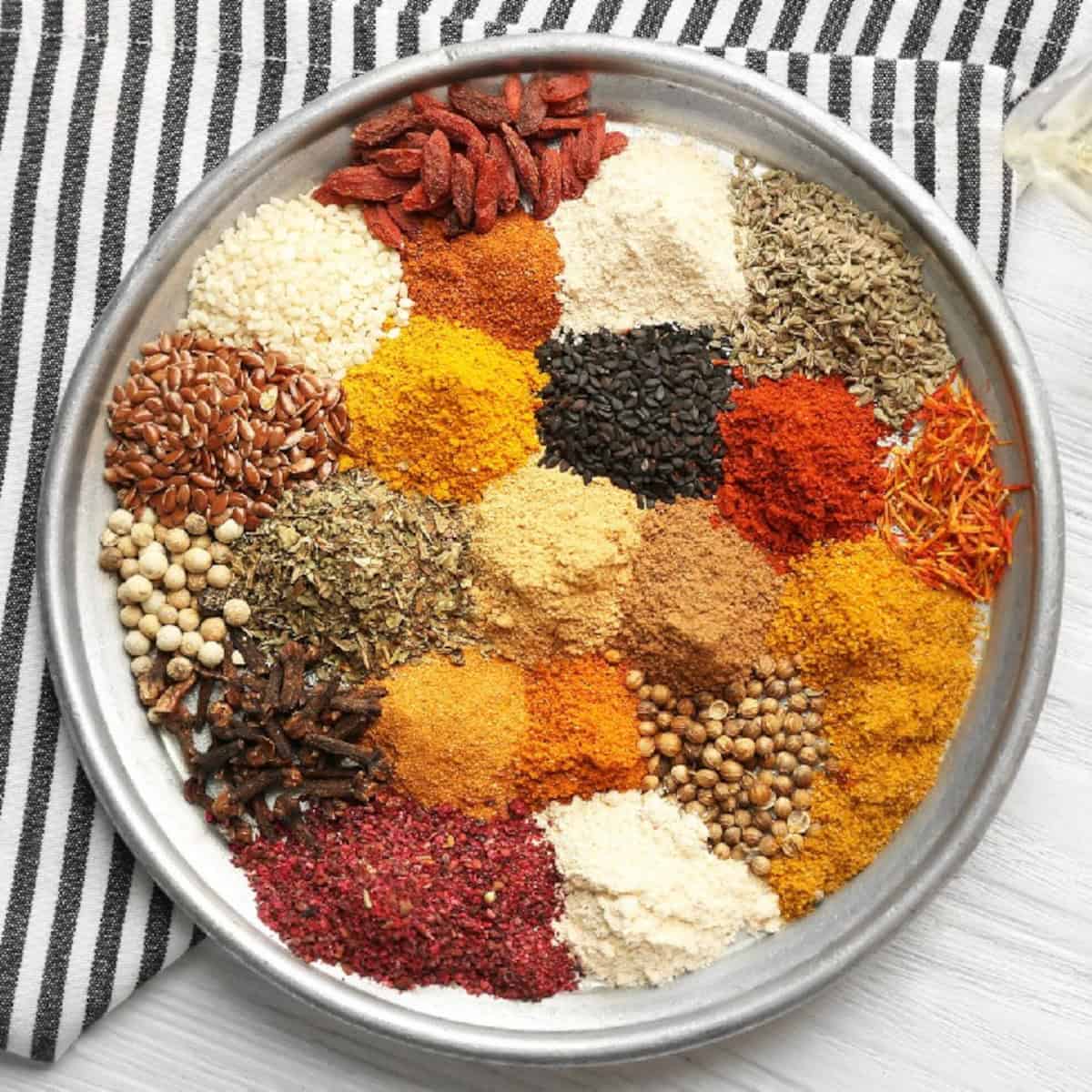 A pan filled with colorful spices and herbs.