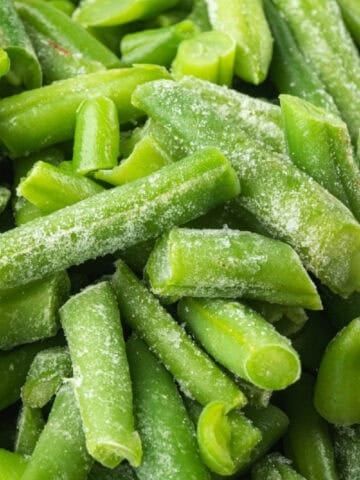 A pile of frozen green beans is ready to be cooked.