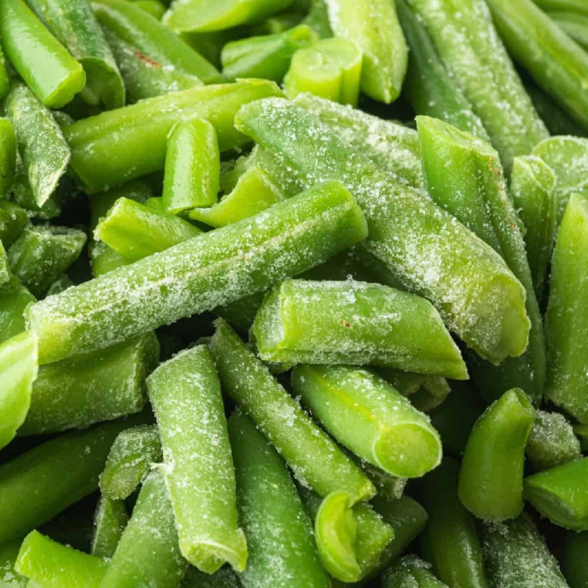 A pile of frozen green beans is ready to be cooked.