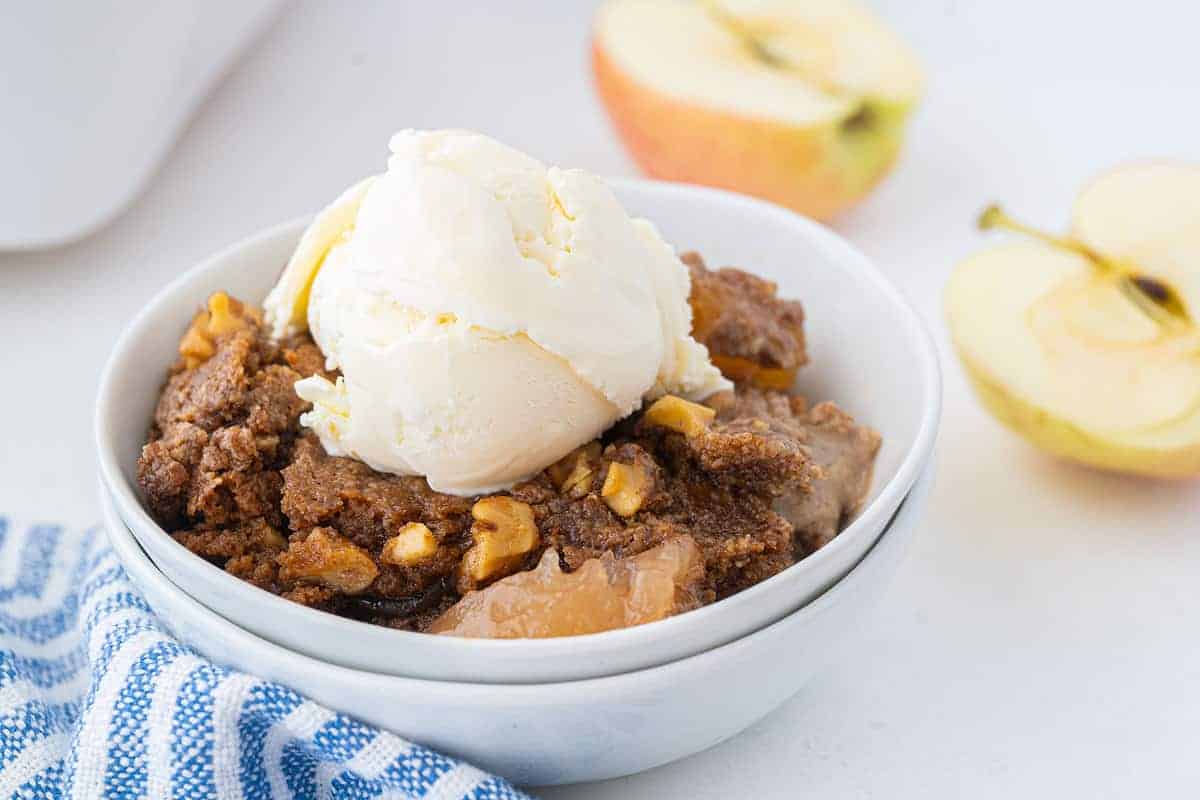 Warm apple dump cake with a golden crumb topping, ready to serve.