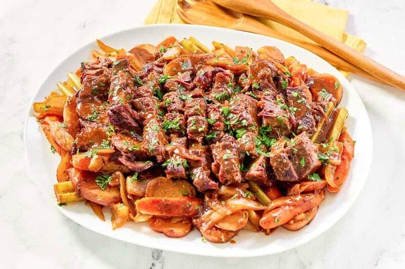 Pot roast with vegetables in rich gravy.