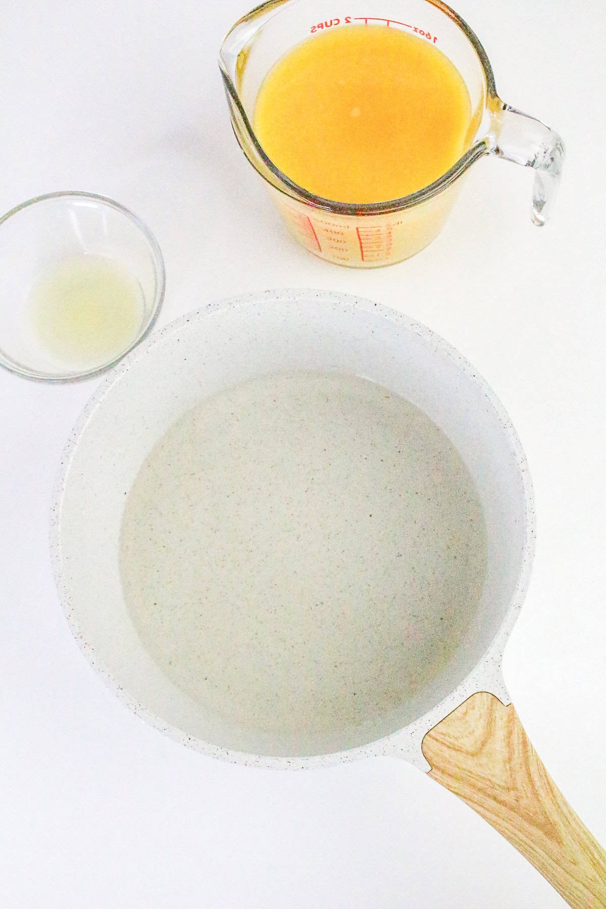 Simple ingredients for orange sorbet: water, orange juice, and lemon juice.