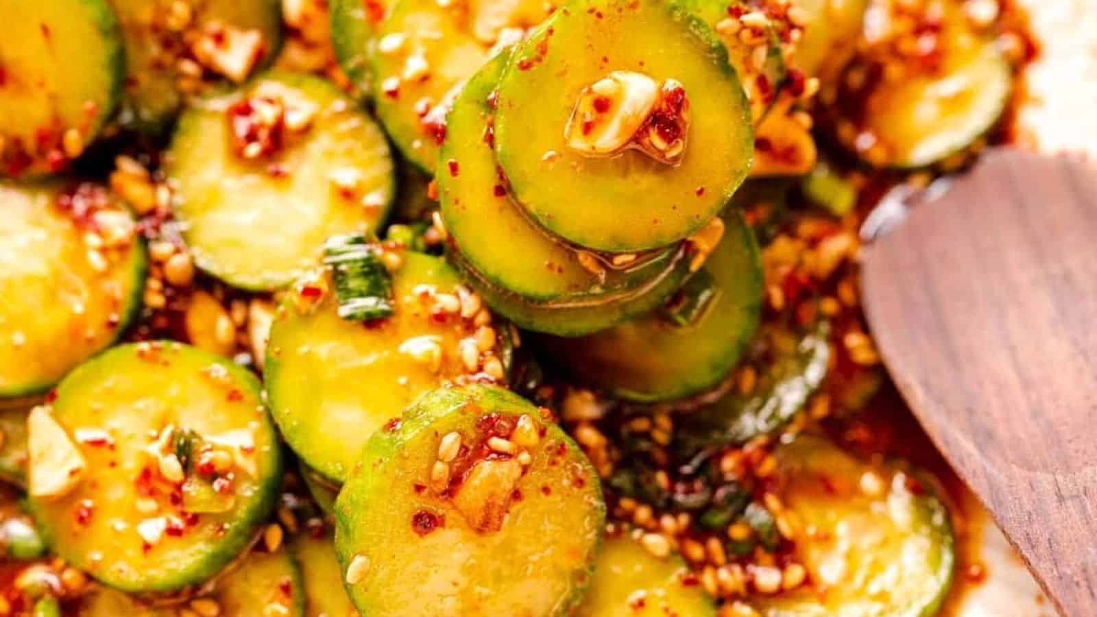 Spicy marinated cucumber slices with sesame seeds.