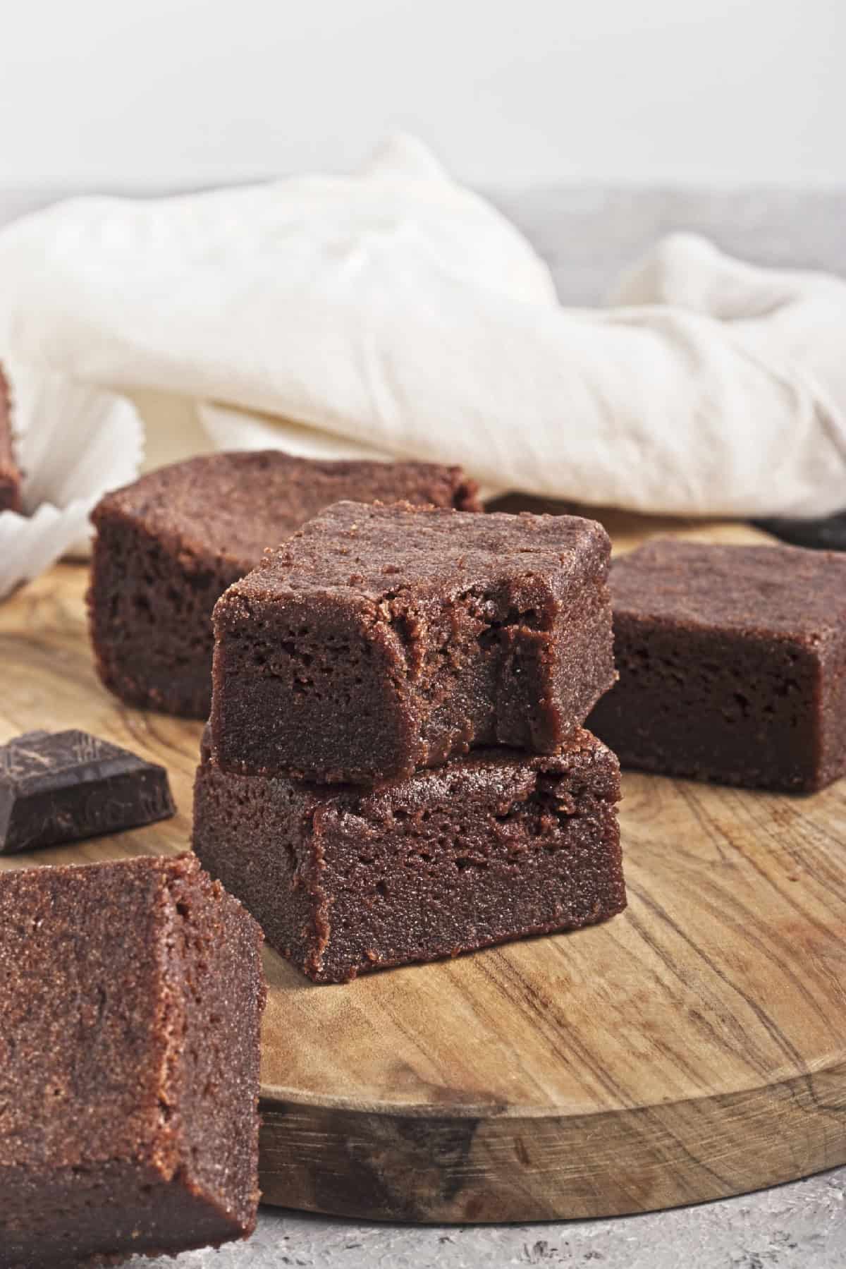 Chocolate Butter Mochi on a brown cutting board,