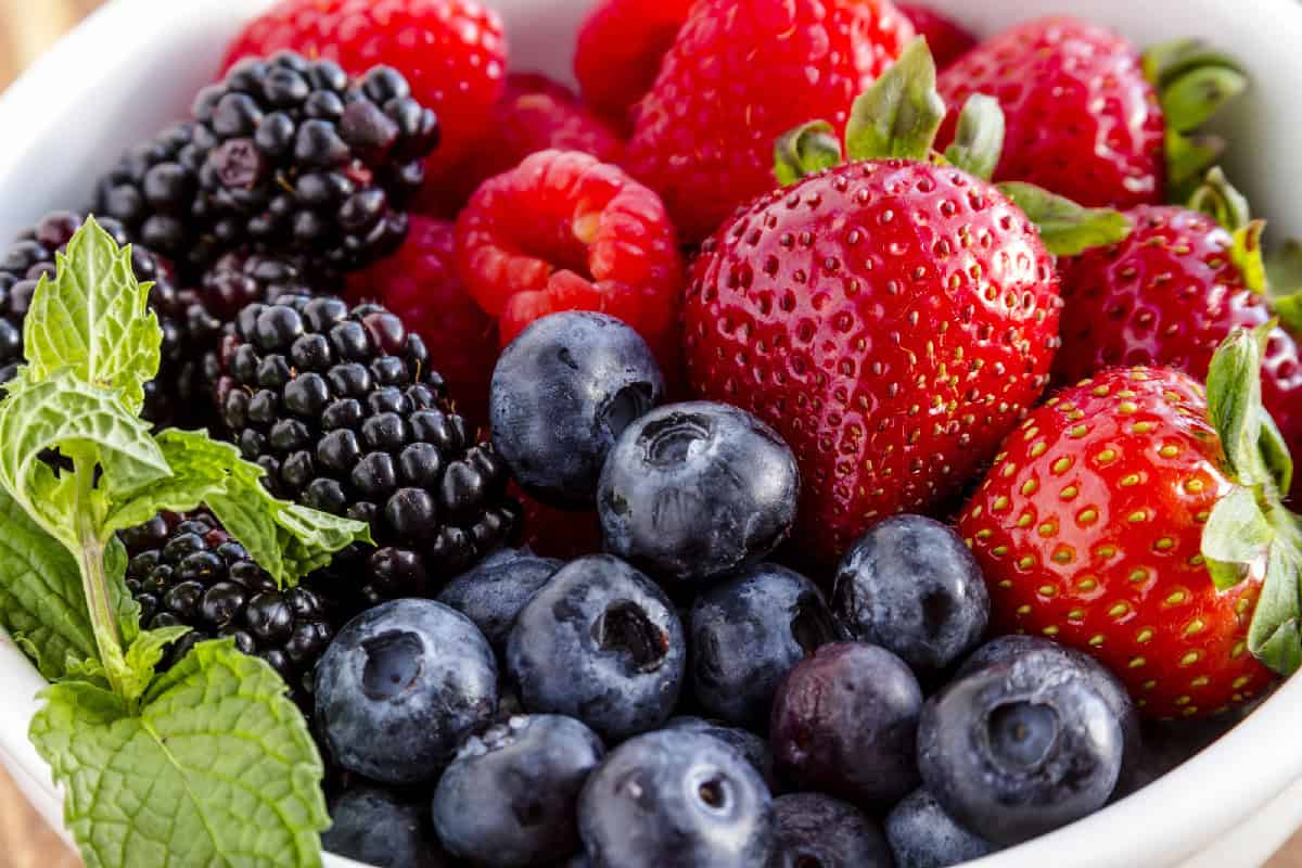 Summer berries in a white bowl.
