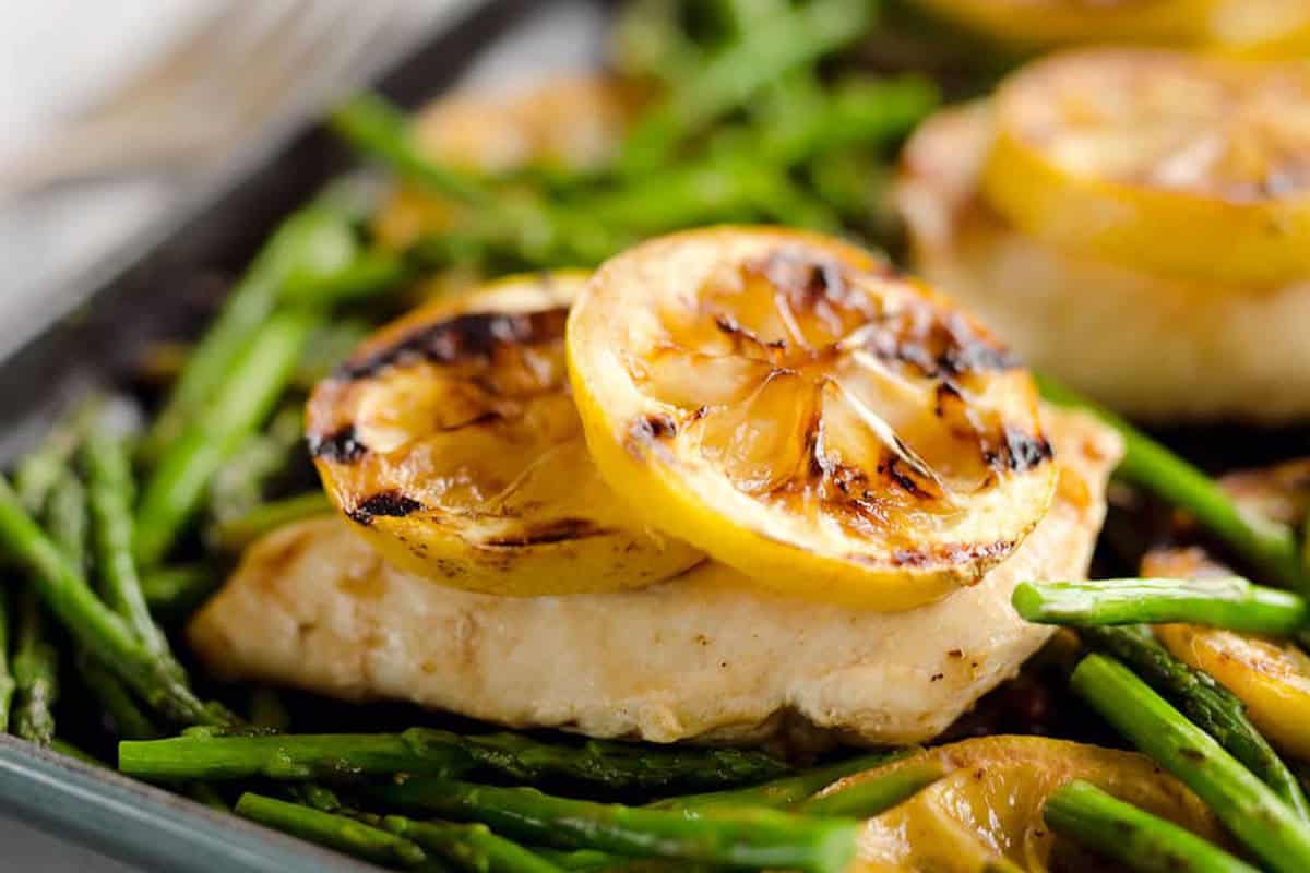 Grilled lemon chicken in a cast iron pan.