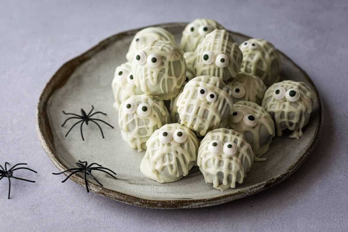 Chocolate truffles with spooky Halloween decor.