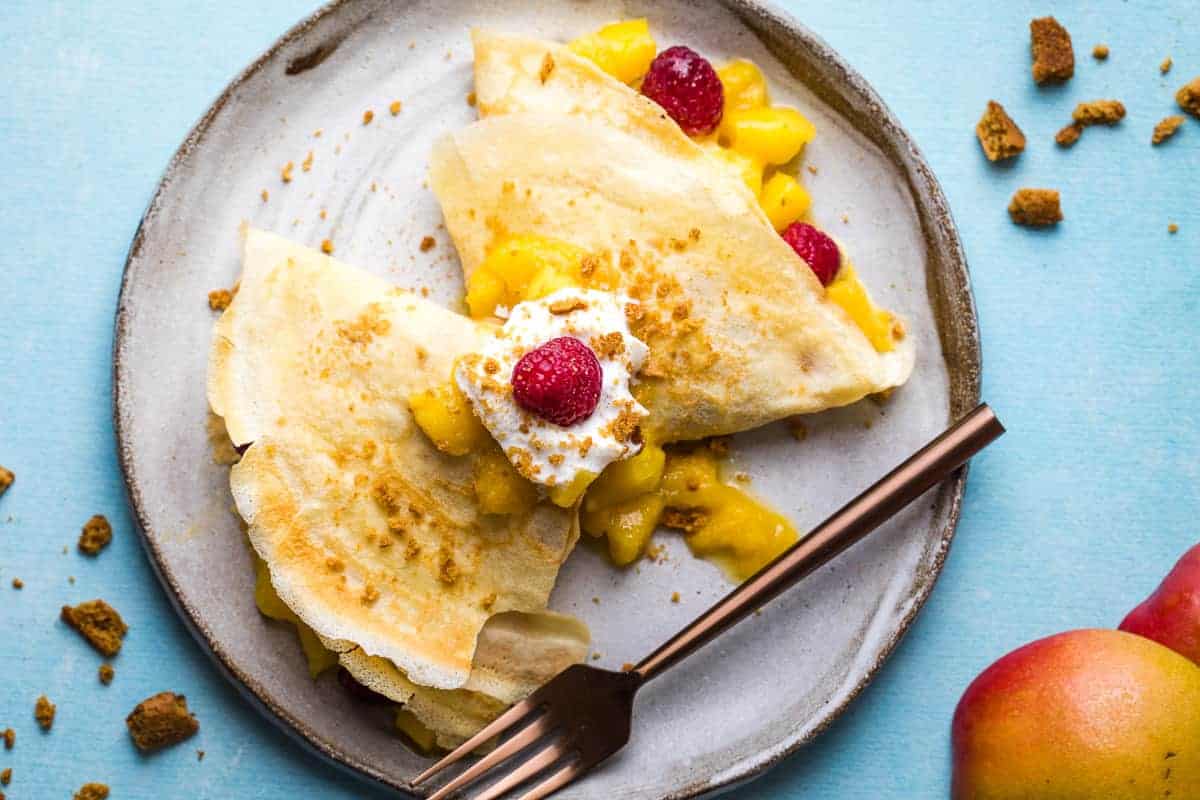 Thin crepes filled with fresh mango slices.
