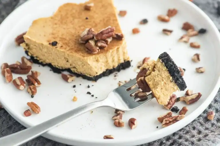 Creamy pumpkin cheesecake on a chocolate crust.