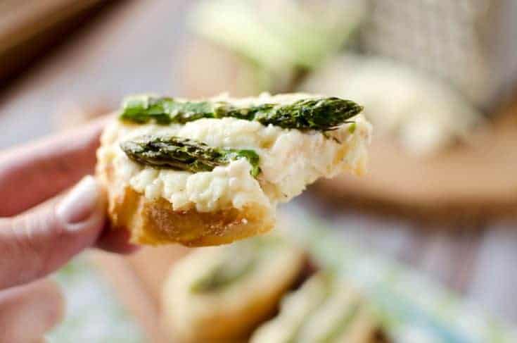 Crostini layered with smoked salmon, asparagus, and cheese.