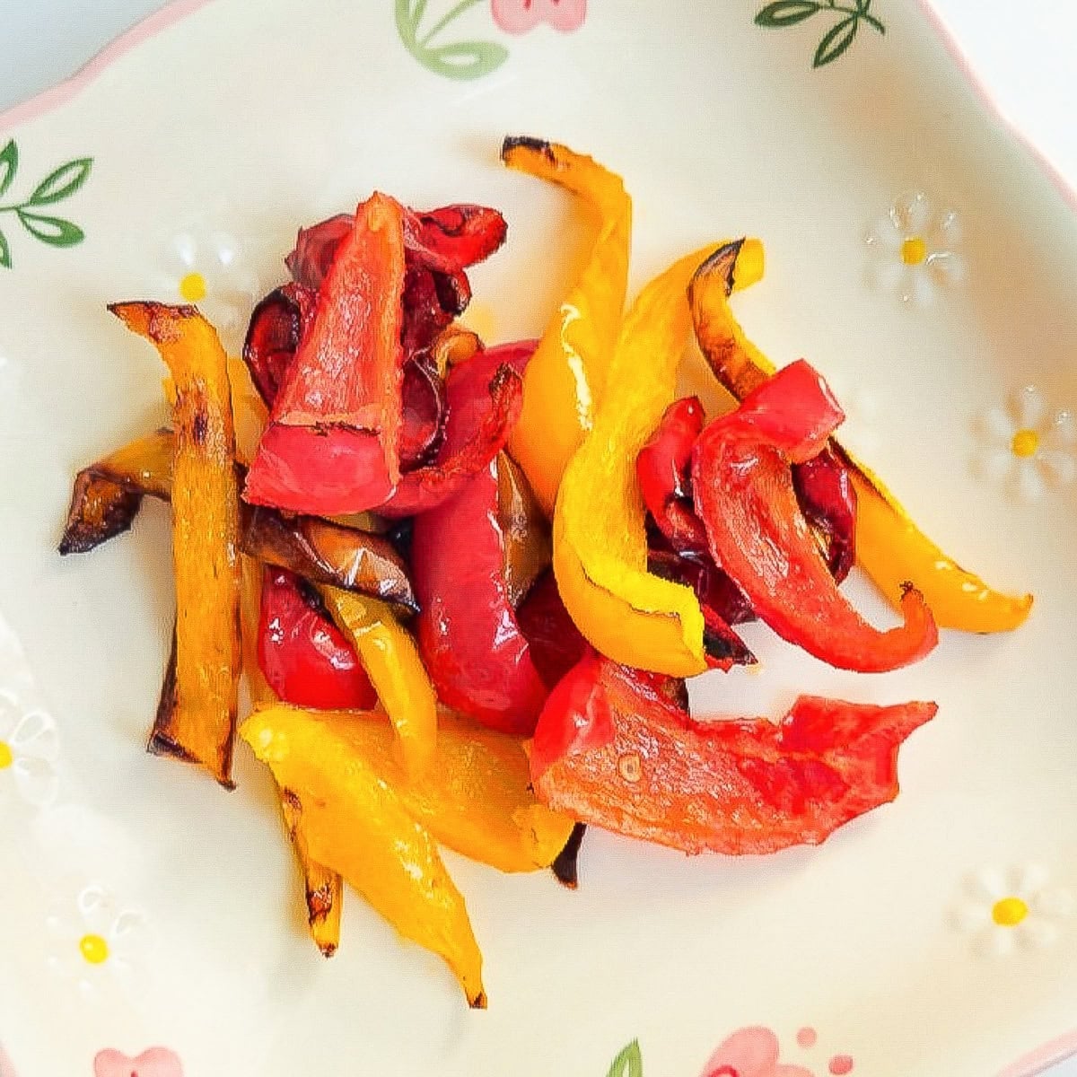 Crispy, charred bell pepper slices after air frying, plated beautifully.