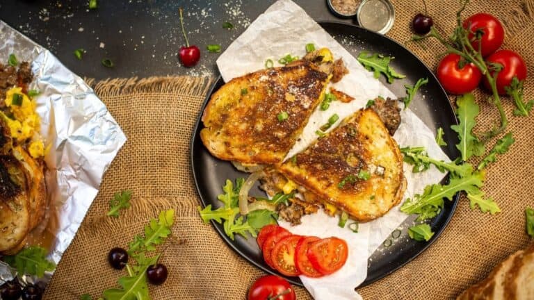 Grilled sandwich with eggs and bacon.