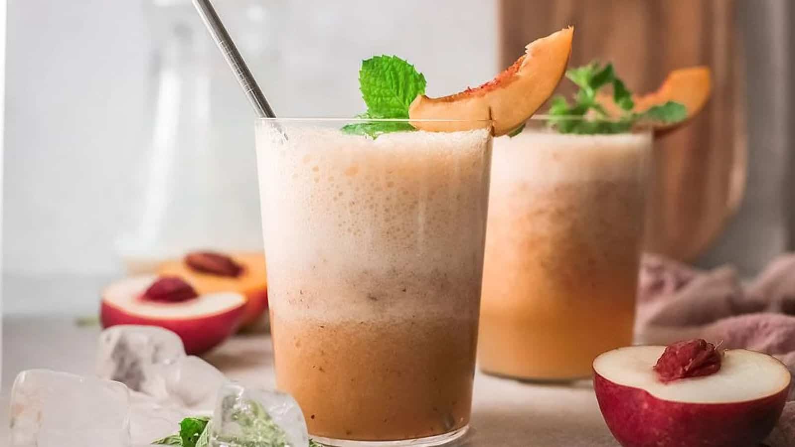 Frozen peach bellini in flute with peach garnish.