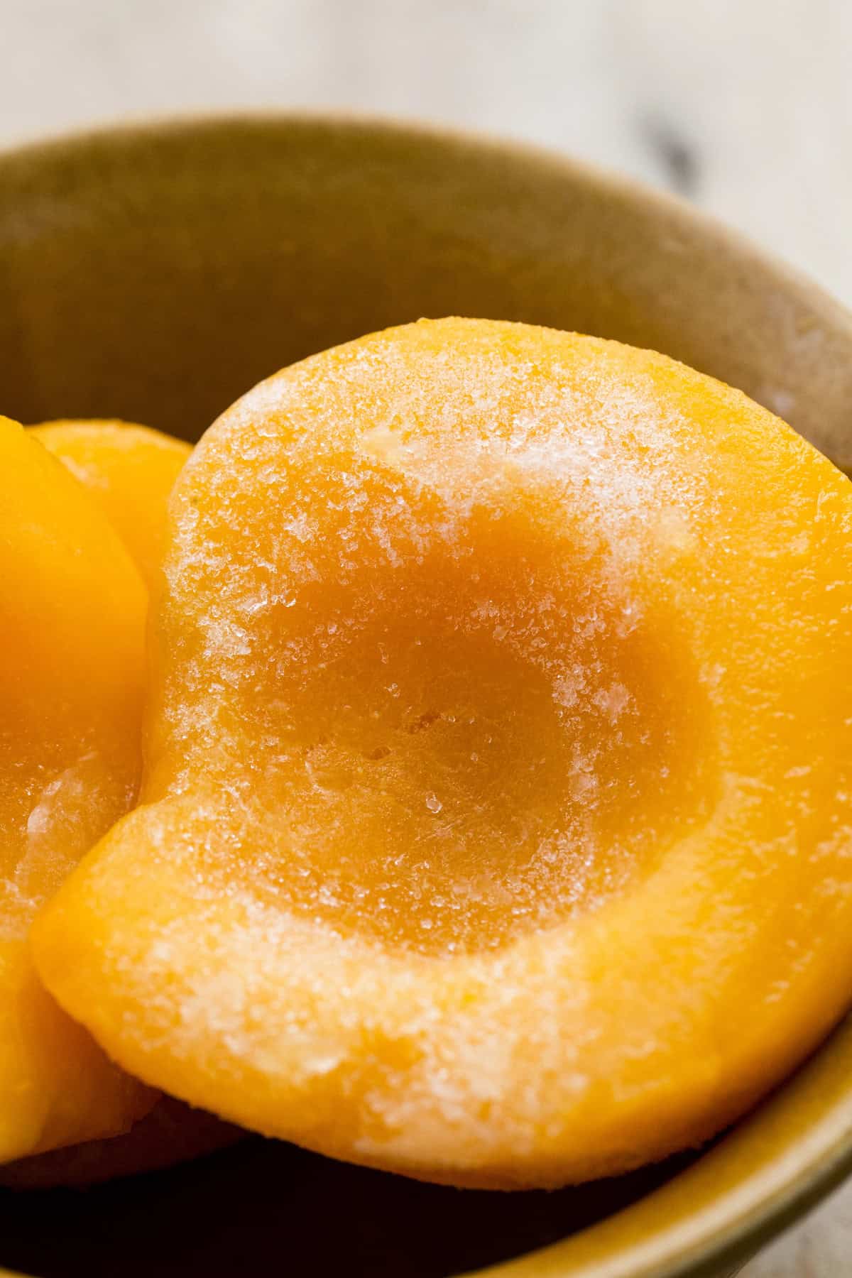 Close-up of frozen peach halves, perfect for smoothies, desserts, and baking year-round.