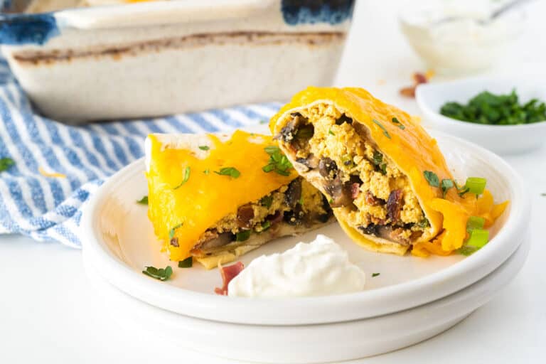 Baked breakfast burritos wrapped and golden.