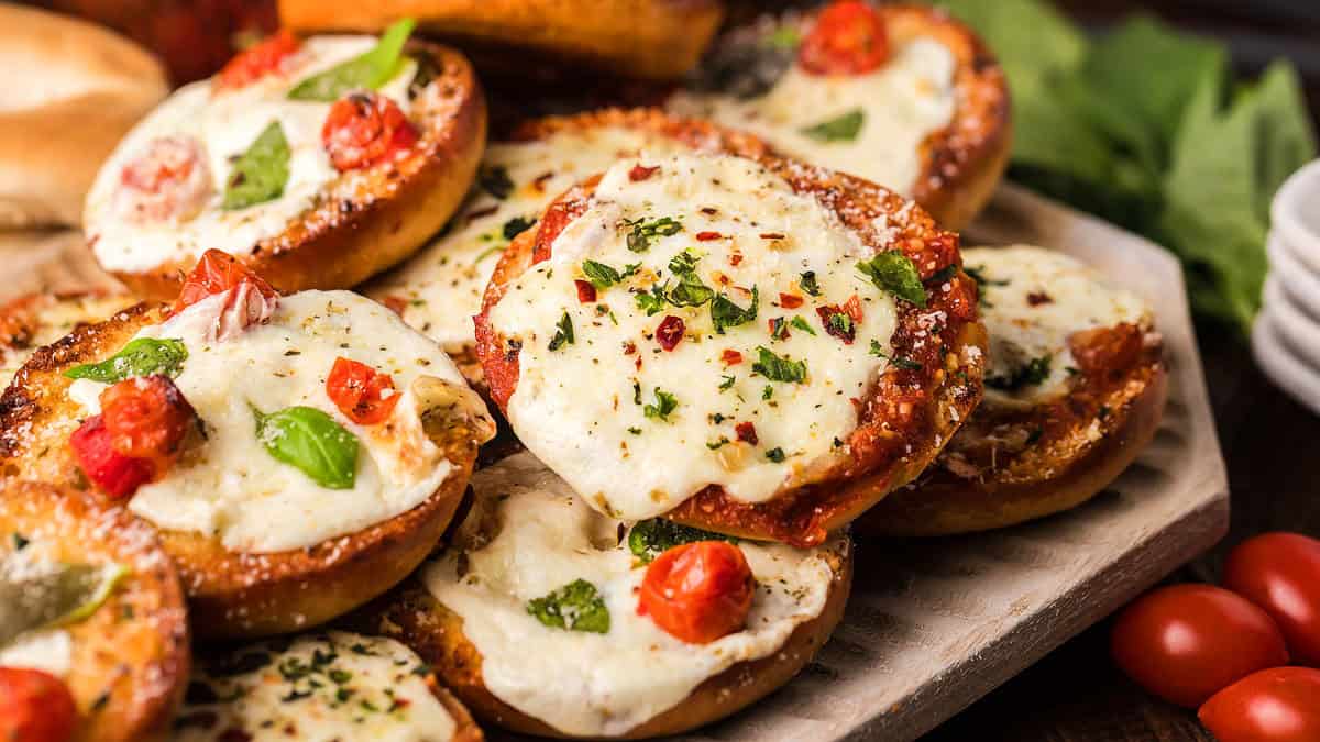 Bite-sized bagels topped with sauce, cheese, and pepperoni.