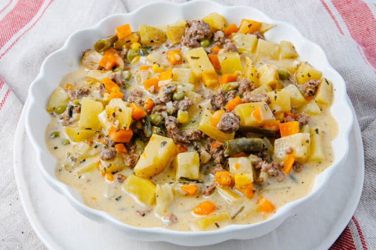 Creamy hamburger potato soup in a bowl.