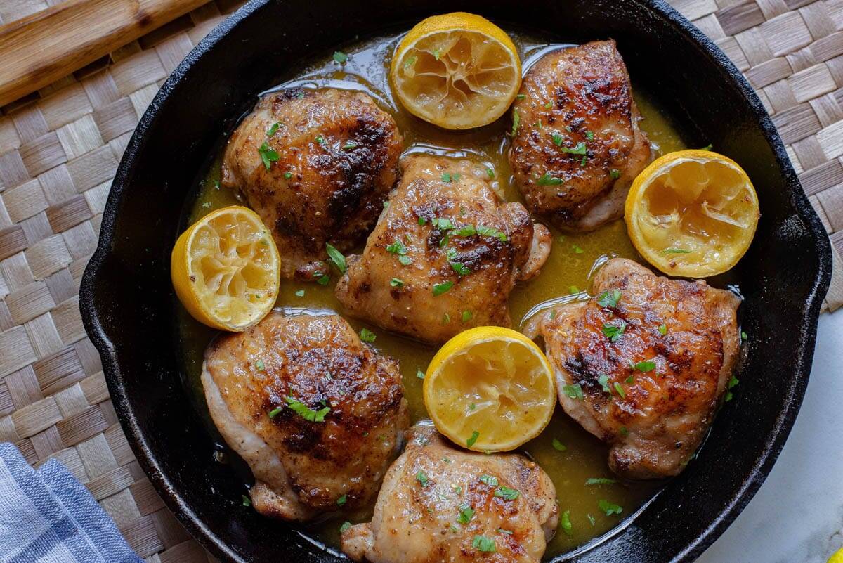 Juicy baked chicken thighs with Greek herbs and spices.