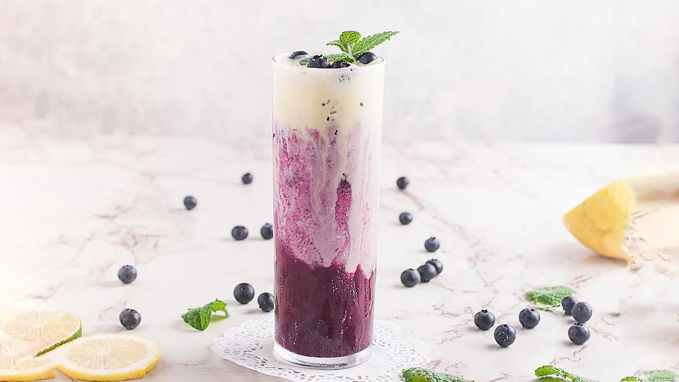Fizzy blueberry soda with a scoop of ice cream.