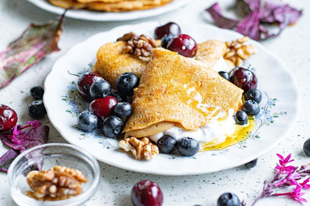 Carrot cake vegetable crepes served with berries.