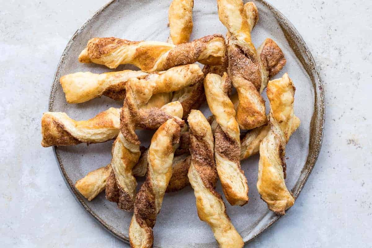 Twisted pastry sticks coated in cinnamon sugar.
