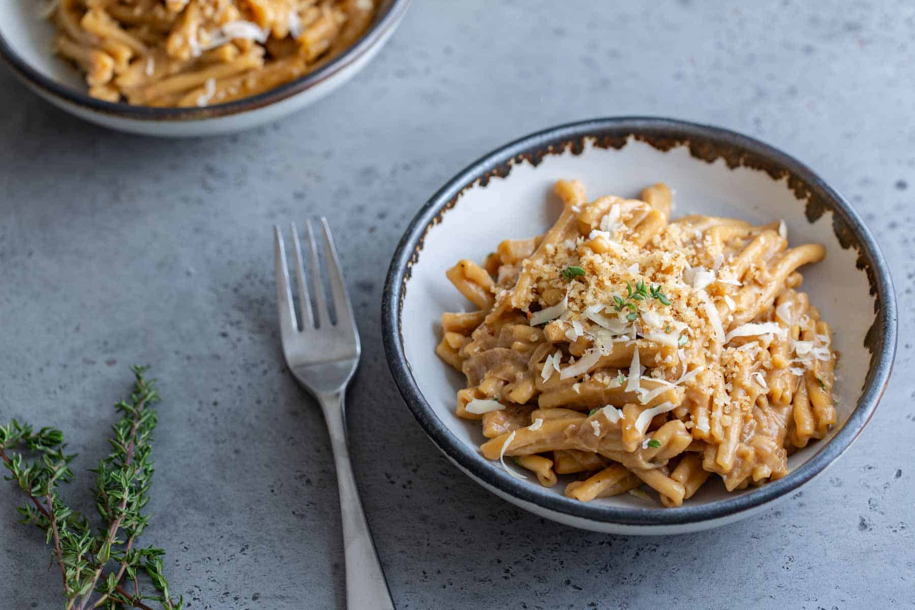 Pasta with caramelized onions and creamy sauce.