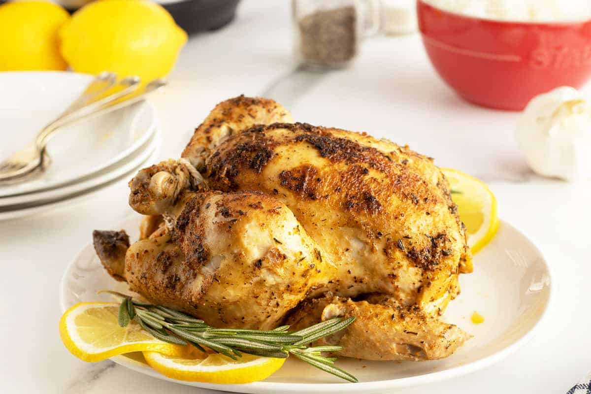 Whole chicken cooked in an Instant Pot with herbs.