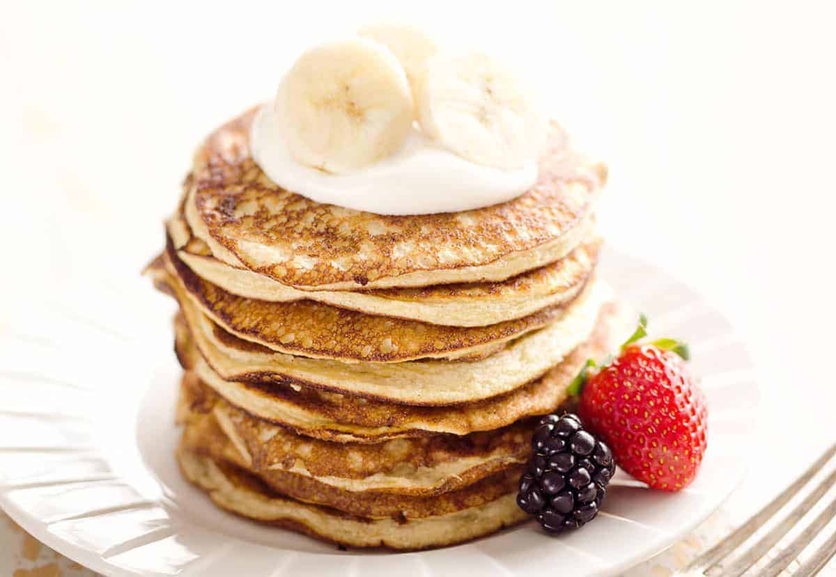 Light banana protein pancakes with sliced bananas.