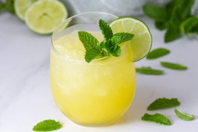 Refreshing pineapple mocktail with mint leaves.