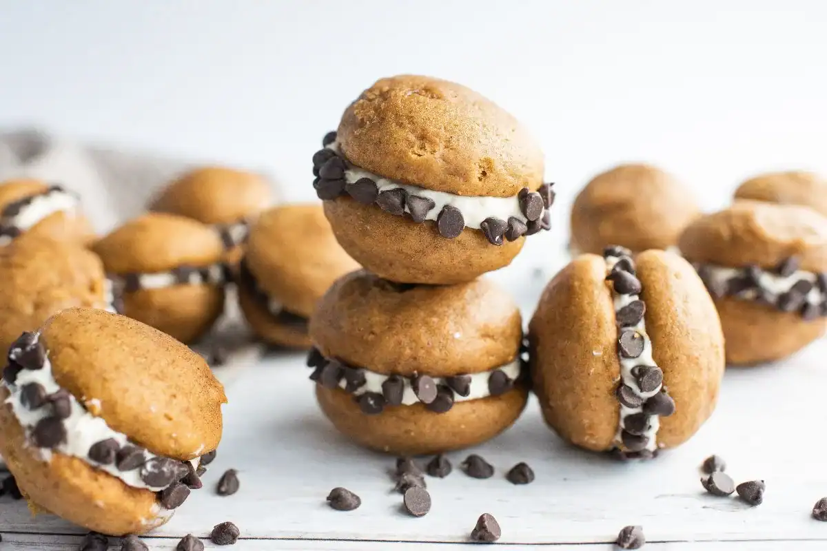 Soft pumpkin whoopie pies with cream cheese and chocolate chips.
