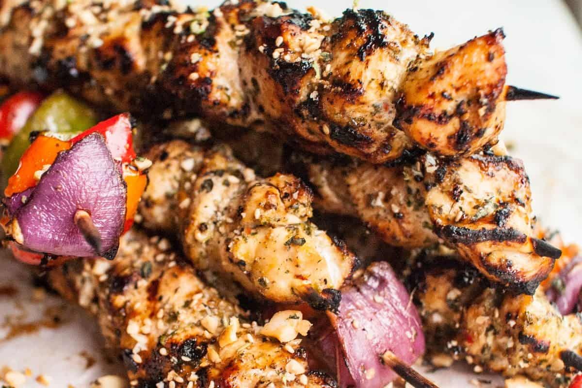 Thai basil chicken skewers served with cashew sauce.