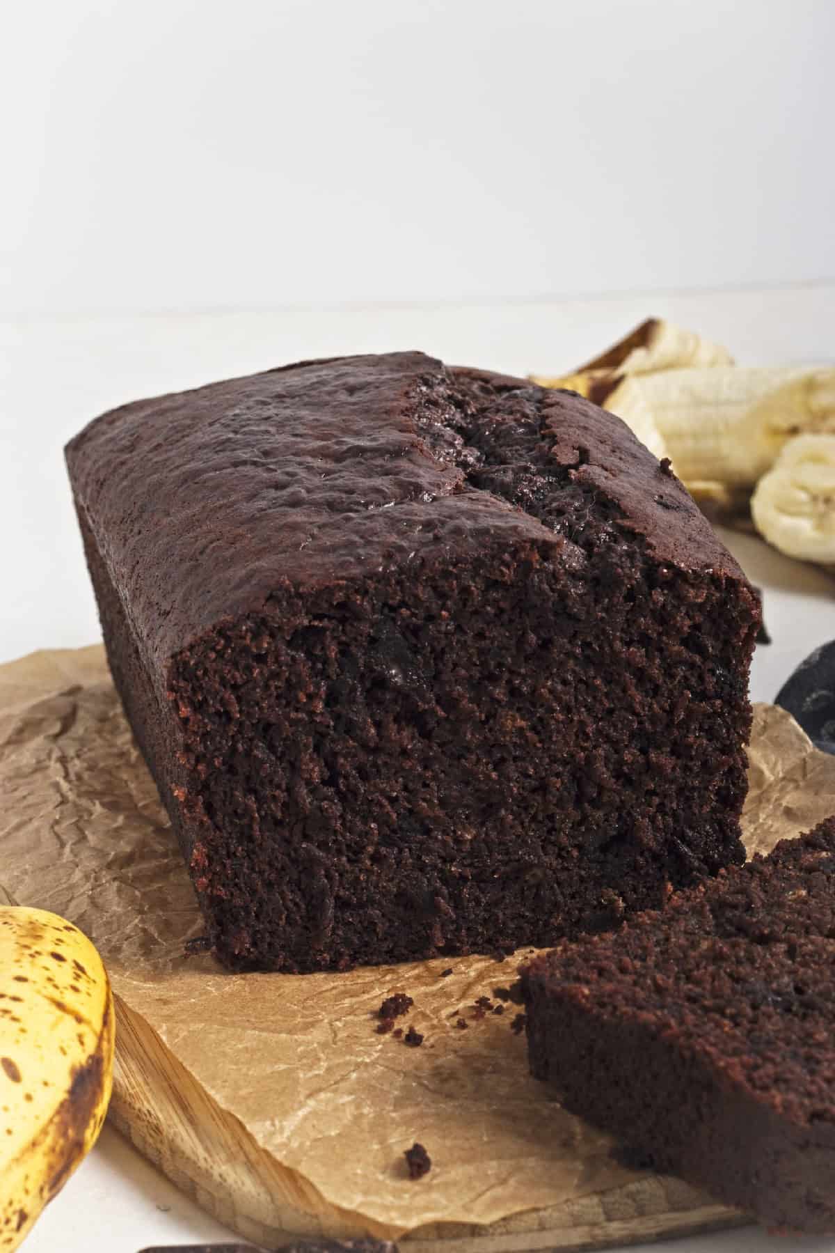 Close-up of moist vegan chocolate banana bread slice showing texture.