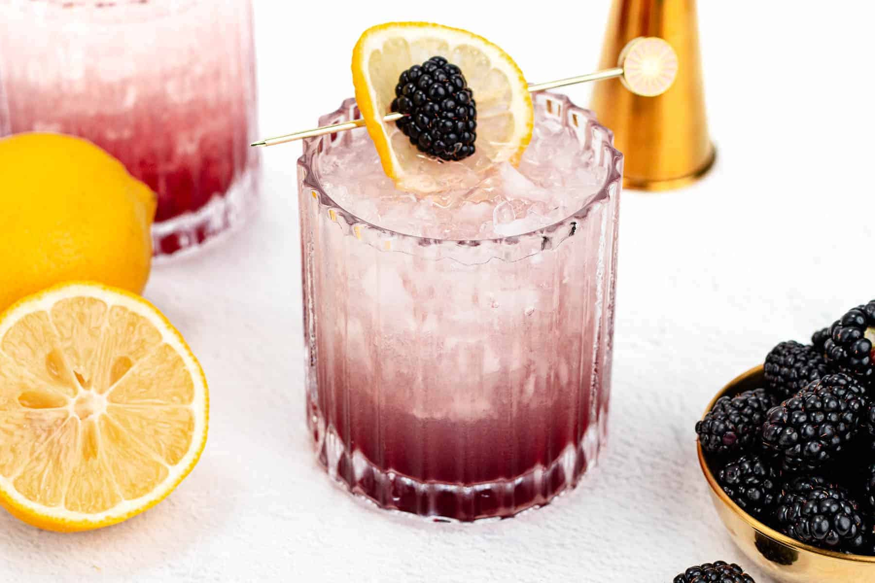 Gin cocktail with lemon juice and blackberry liqueur.